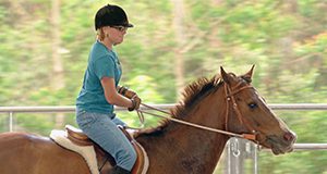 A photo of a person riding a horse.