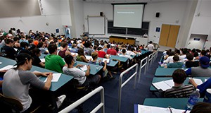 Students in a classroom taking a test.