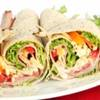 Tortilla wraps with deli meat, cheese and vegetables.