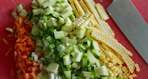 Fresh vegetables being cut.