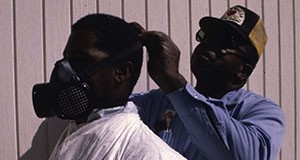 Pesticide handlers putting on protective equipment